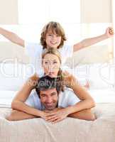 Cute child and his parents having fun