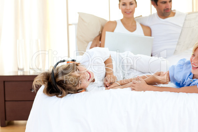 Lively siblings listening music and having fun