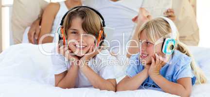 Close-up of brother and sister listening music