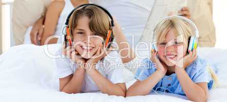 Close-up of siblings listening music
