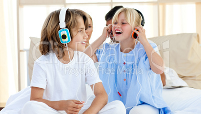 Joyful children having fun and listening music