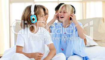 Joyful children having fun and listening music
