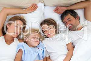 Loving family sleeping together