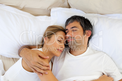 Caring lovers sleeping lying in the bed
