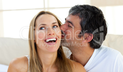 Close-up of man kissing his girlfriend