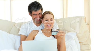 Affectionate couple buying on internet