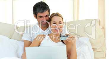 Affectionate couple buying on internet