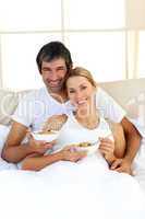 Blond woman and her boyfriend eating cerelals