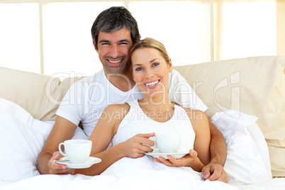 Attractive woman and her boyfriend drinking coffee