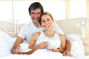 Attractive woman and her boyfriend drinking coffee