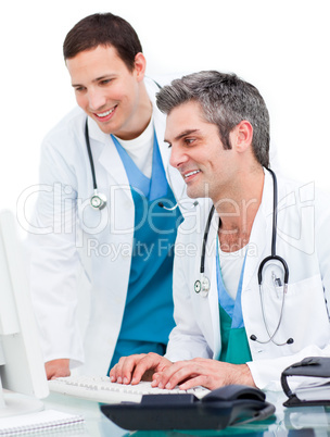 male doctors at a computer