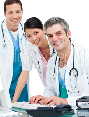 Medical team working at a computer