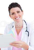 Brunette doctor reading paper
