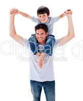 Positive father giving his son piggyback ride