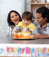 family celebrating the son's birthday