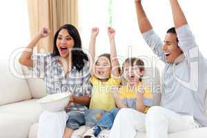 Animated family watching TV on sofa