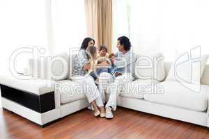 Animated family having fun sitting on sofa