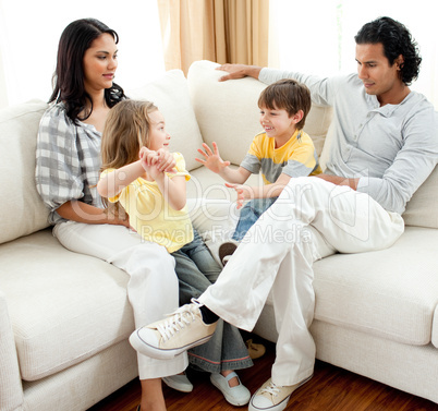 Lively family having fun in the living room