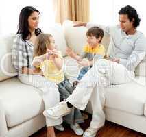 Lively family having fun in the living room