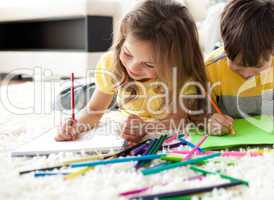 Close-up of children drawing lying on the floor