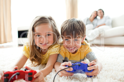 Loving siblings playing video game