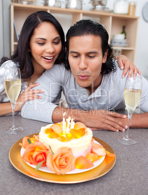 Happy man and his wife celebrating his birthday