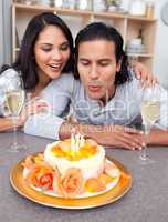 Happy man and his wife celebrating his birthday