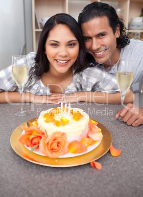 Brunette woman and her husband celebrating her birthday