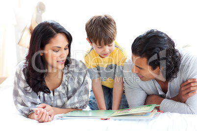 Affectionate family reading book together