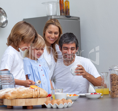 Joyful family having breakfast