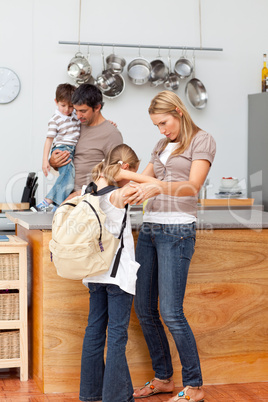 Family in the kitchen before going to school