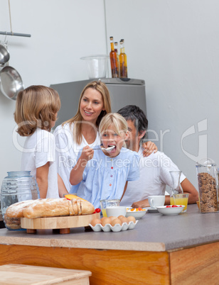 Jolly family having breakfast