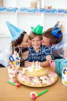 Affectionate parents celebrating their son's birthday