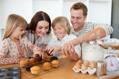 Loving family eating their muffins