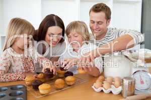 Loving family eating their muffins
