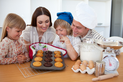Merry family presenting their muffins