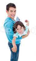 Charming father giving his son piggyback ride