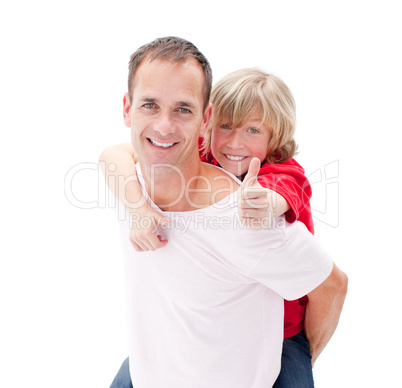 Blond little boy enjoying piggyback ride with his father