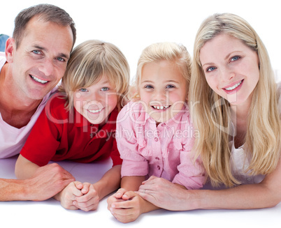 Portrait of family lying on the floor