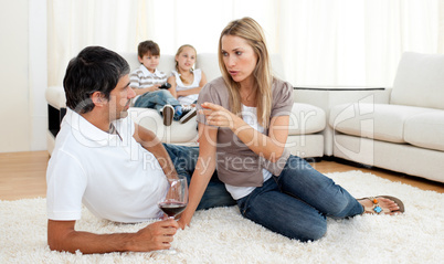 Intimate couple talking with glasses of wine