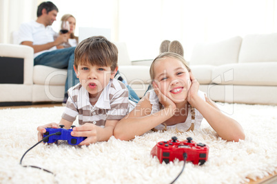 Adorable siblings playing video games