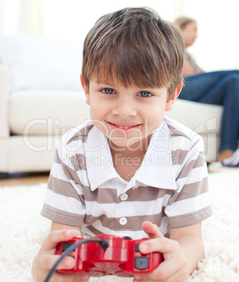 Close-up of little boy playing video games