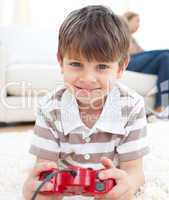 Close-up of little boy playing video games