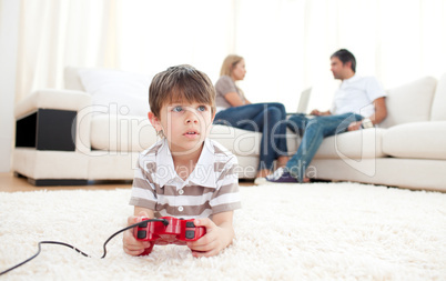 Cute little boy playing video games