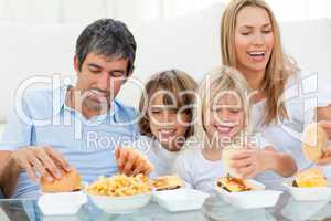 Loving family eating hamburgers