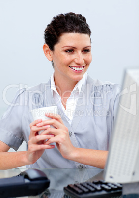 Self-assured business woman drinking coffee