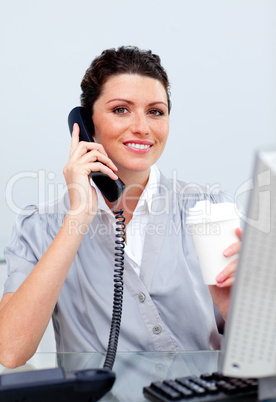 Joyful business woman on phone