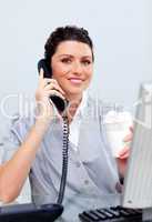 Joyful business woman on phone