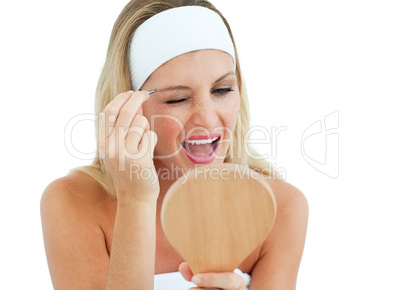 Blond woman using tweezers