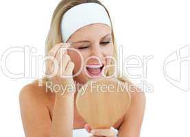 Blond woman using tweezers